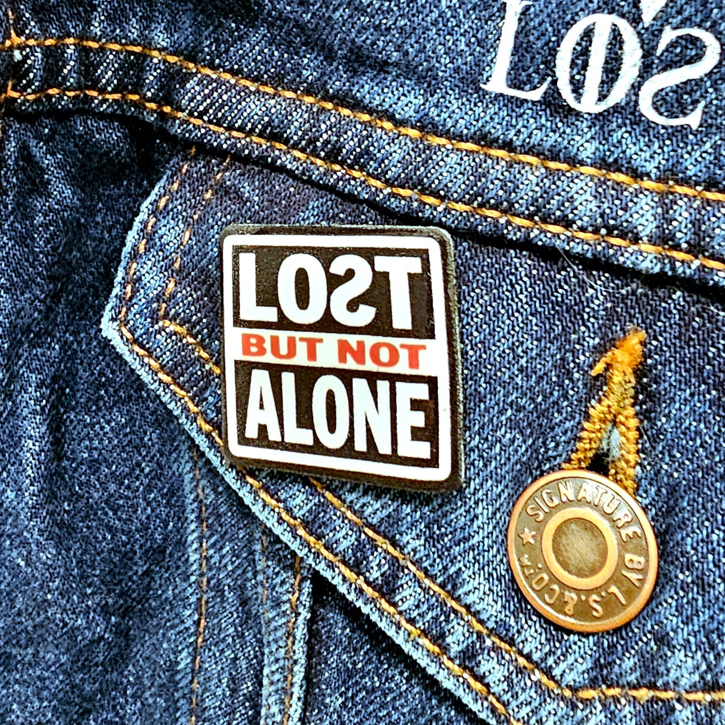 LOƧT BUT NOT ALONE pin with extended post and rubber stopper.