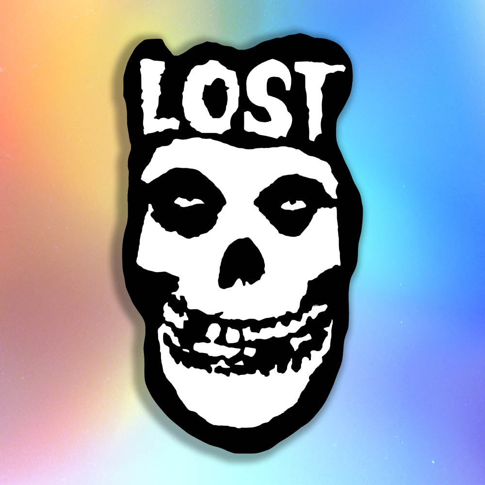 The Crimson Ghost Graffiti Sticker by LOST. A modern example of the classic black and white skull logo re-invented. The Word LOST is scrawled across the top in Bold white letters.