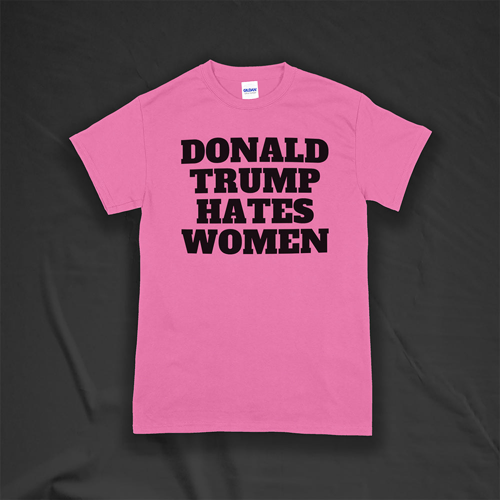 Donald Trump Hates Women t-shirt. Bold letters screen printed with black ink on a azalea pink shirt.
