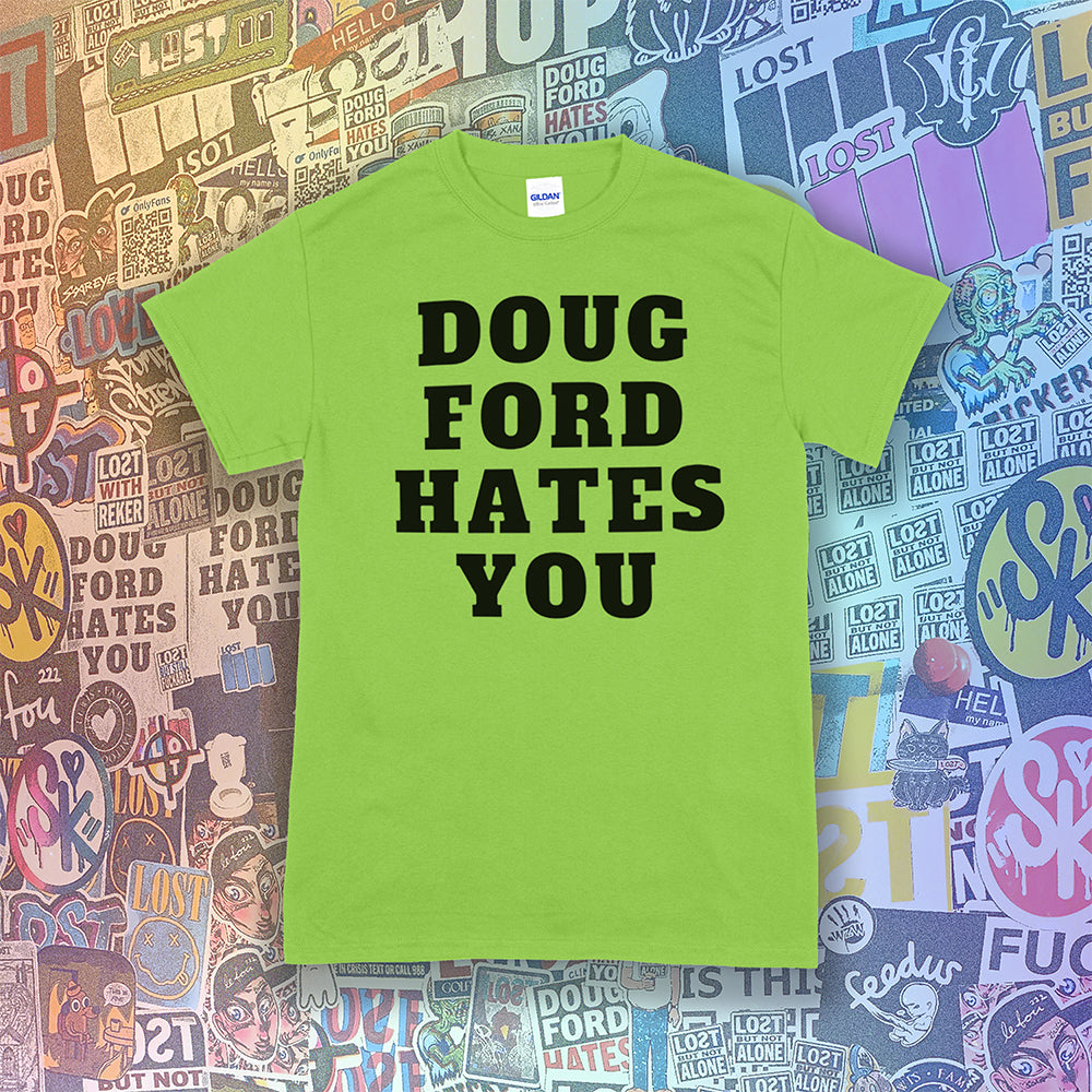 The original Doug Ford Hates You t-shirt. Bold black letters screen printed on a lime green shirt. Assorted colorful graffiti stickers make up the background.