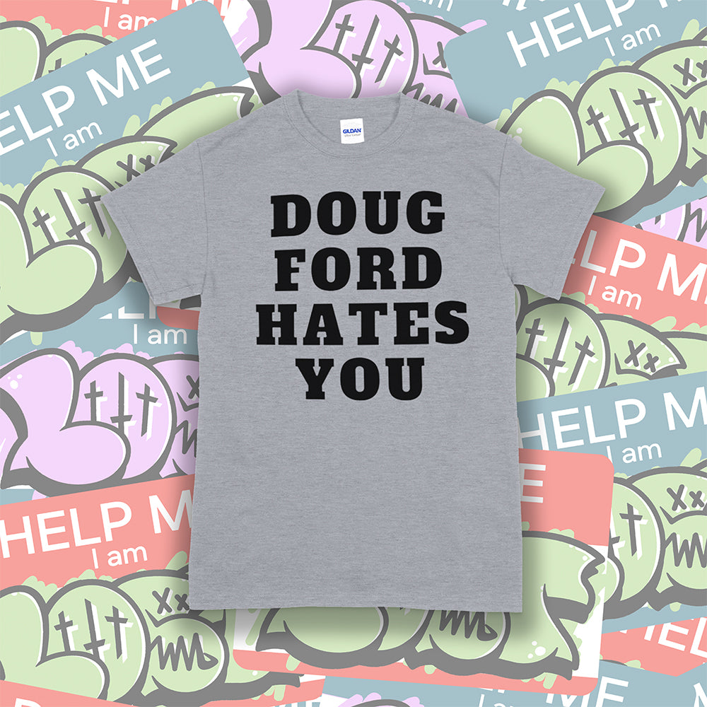 The original Doug Ford Hates You t-shirt. Bold black letters screen printed on a grey shirt. Assorted LOST graffiti stickers make up the background.