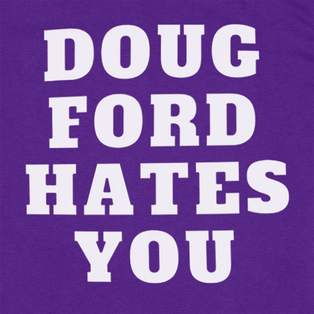 Close up view of The original Doug Ford Hates You t-shirt. Bold white letters screen printed  on a purple shirt. 