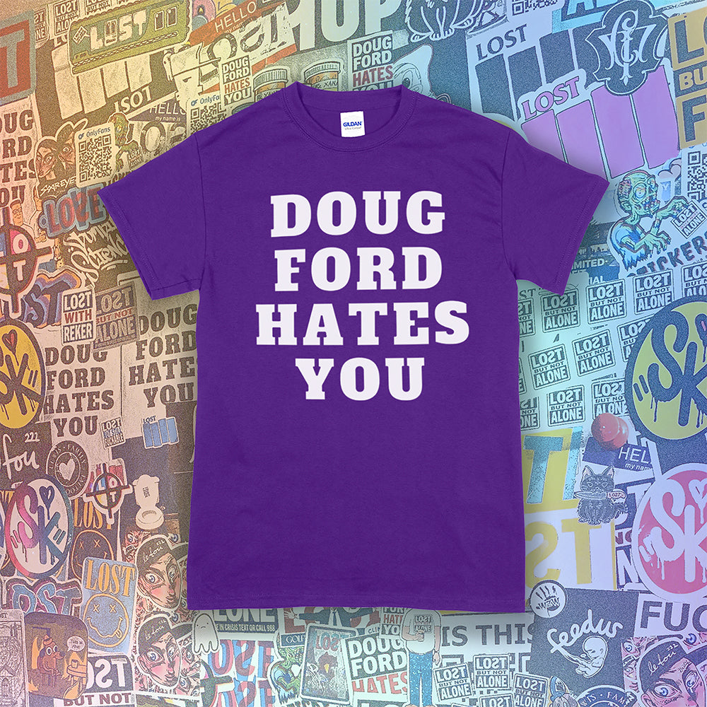 The original Doug Ford Hates You t-shirt. Bold white letters screen printed on a purple shirt. Colorful graffiti stickers make up the background.