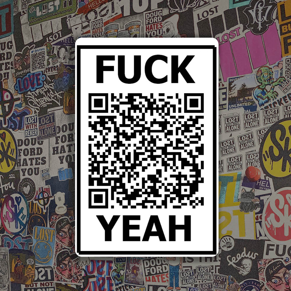 The Fuck Yeah thermal sticker by Lost Black and white design featuring a QR code. A wall of colorful graffiti stickers provides a unique background for the sticker.