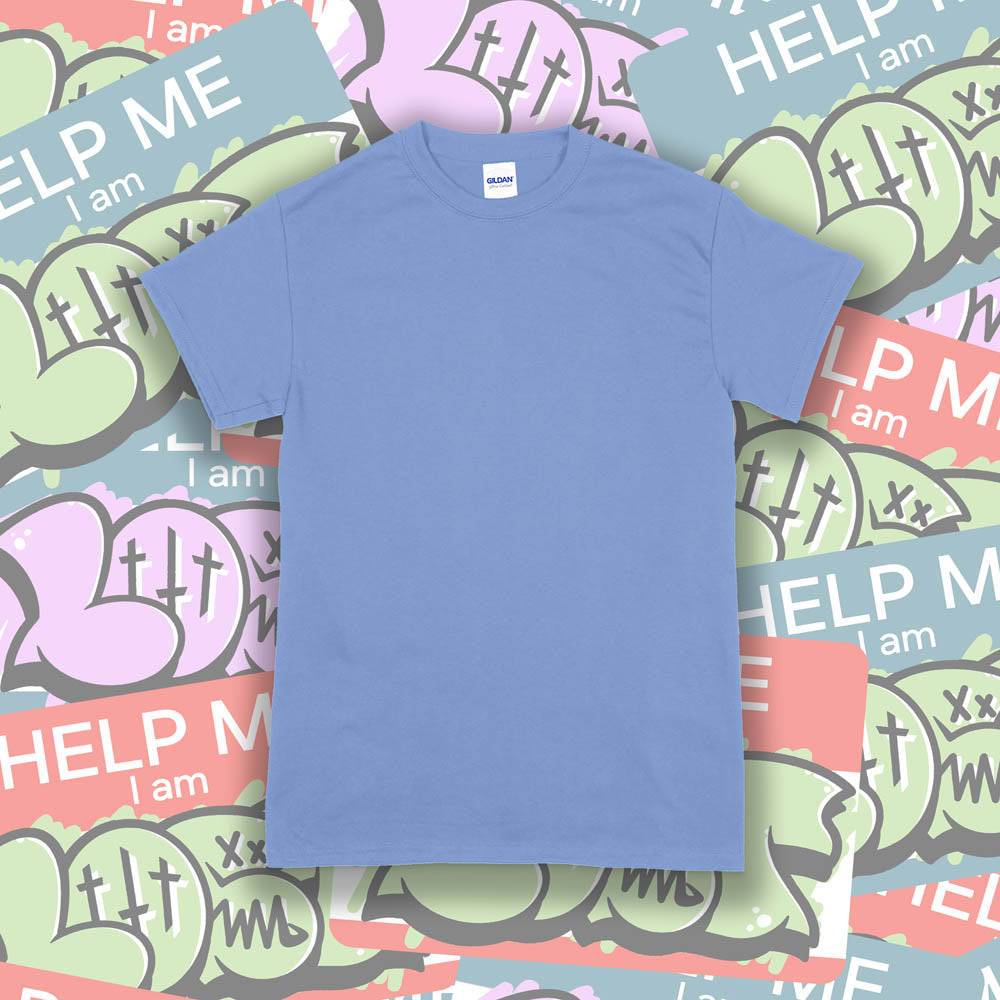 A blank Gildan shirt template. The Carolina blue Gildan t-shirt is displayed against a wall of colorful graffiti stickers.