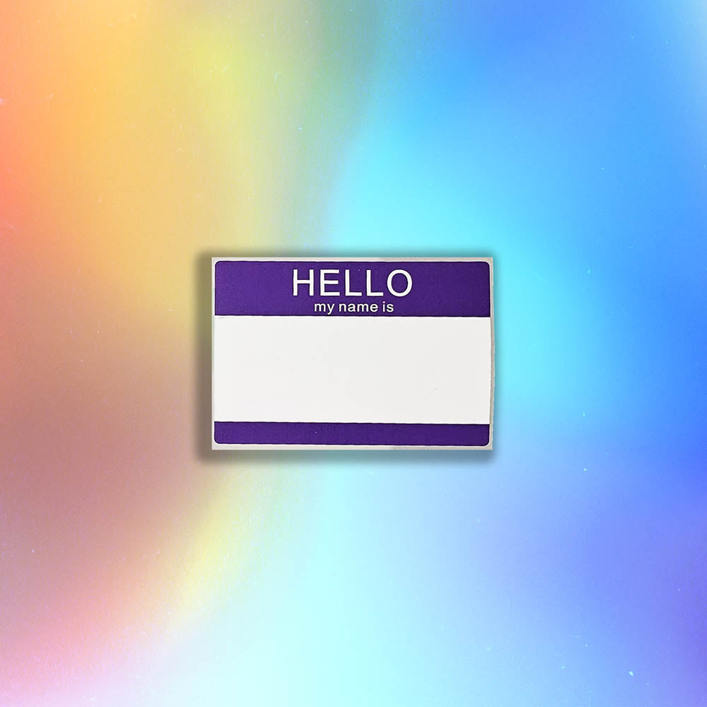 Hello my name is blank nametag sticker. A purple and white nametag sticker waiting to be tagged. The sticker is set against a holographic background.