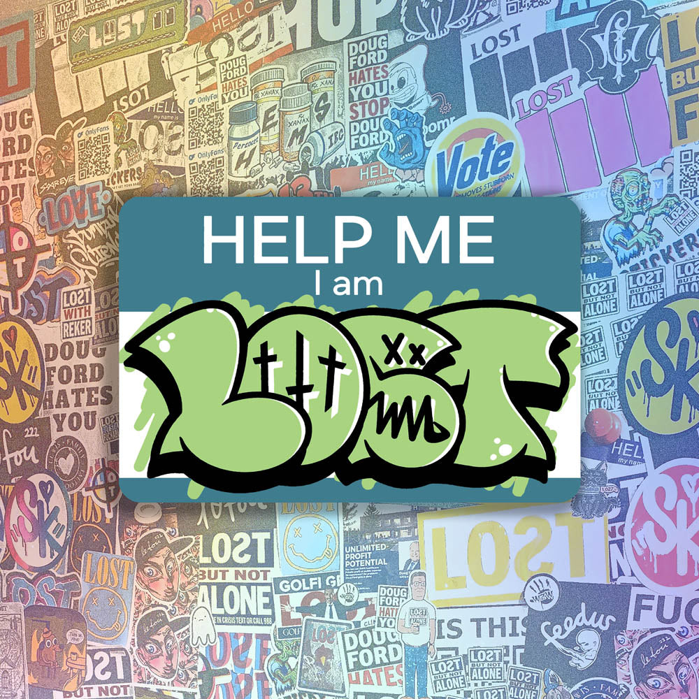 The Help Me I Am Lost graffiti nametag sticker. A blue hello my name is sticker edited to say Help Me I Am followed by a green and black LOST graffiti throwie.