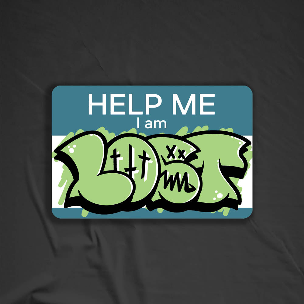 The Help Me I Am Lost graffiti nametag sticker. A blue hello my name is sticker edited to say Help Me I Am followed by a green and black lost graffiti throwie.