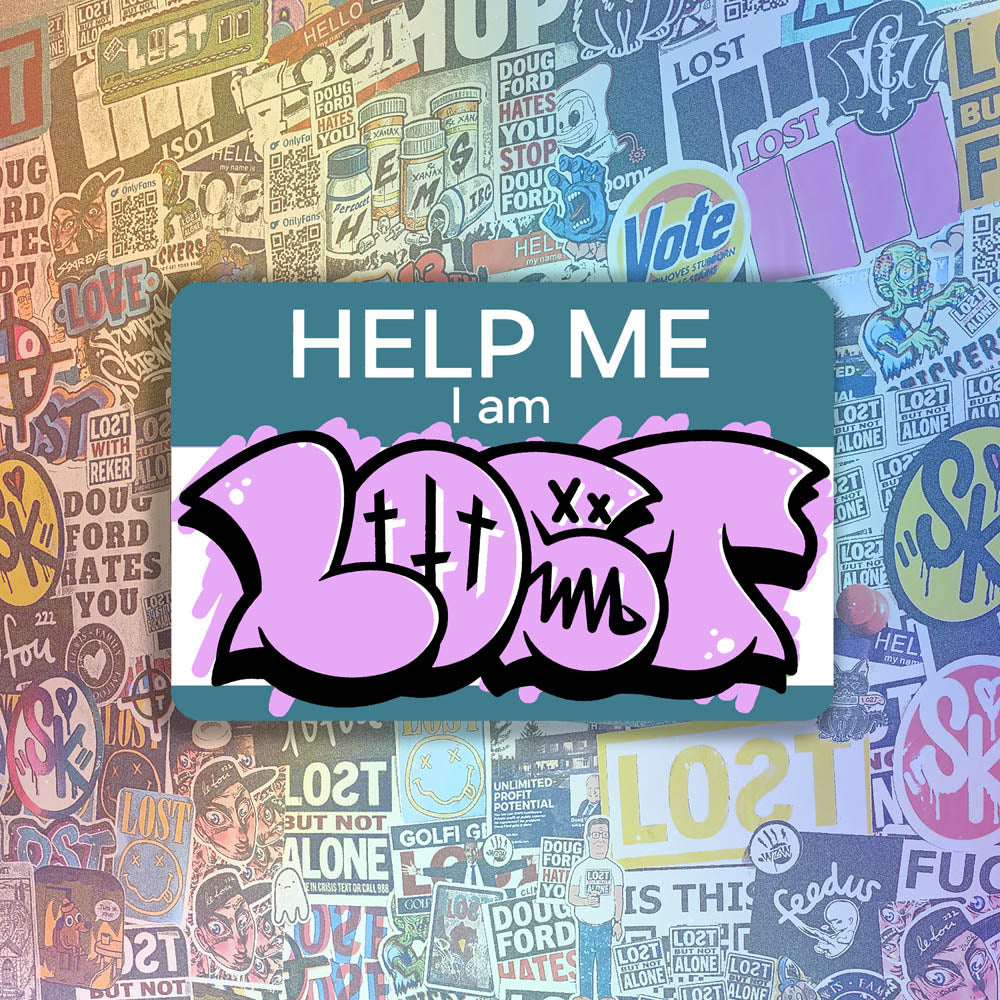 The Help Me I Am Lost graffiti nametag sticker. A blue hello my name is sticker edited to say Help Me I Am followed by a pink and black LOST graffiti throwie.