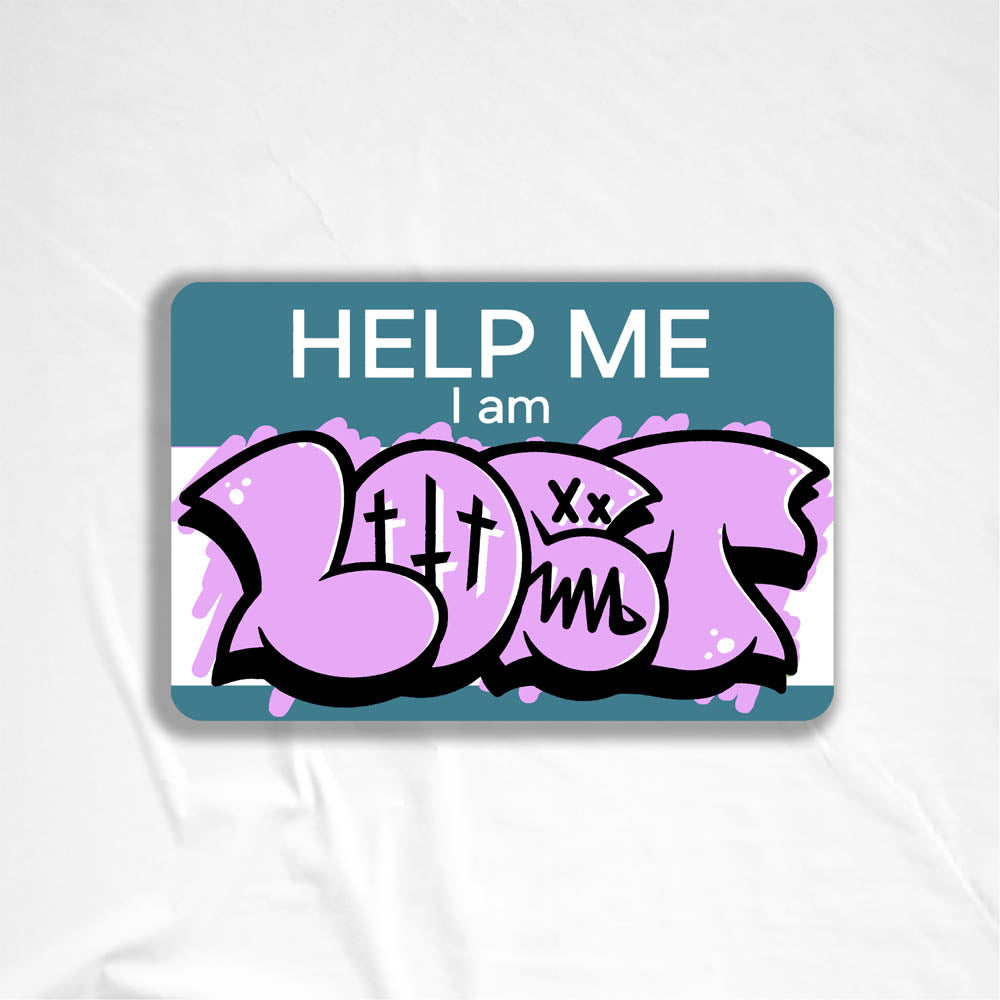 The Help Me I Am Lost graffiti nametag sticker. A blue hello my name is sticker edited to say Help Me I Am followed by a pink and black LOST graffiti throwie.