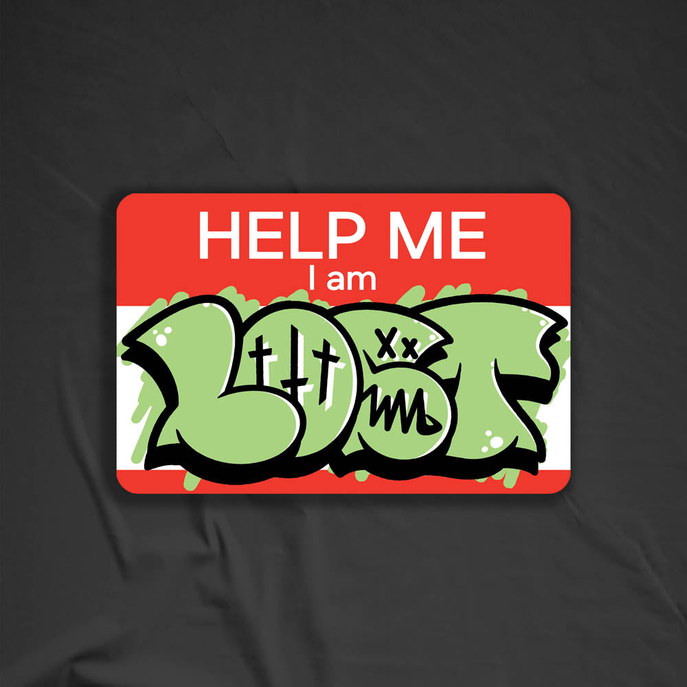 The Help Me I Am Lost graffiti nametag sticker. A red hello my name is sticker edited to say Help Me I Am followed by a green and black lost graffiti throwie.