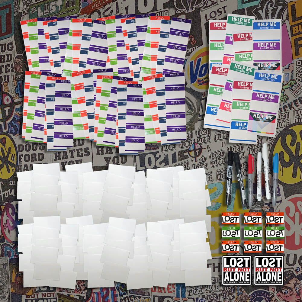 A selection of blank graffiti stickers and markers laid of for display.