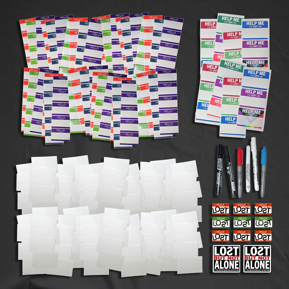 A selection of blank graffiti stickers and markers laid of for display.