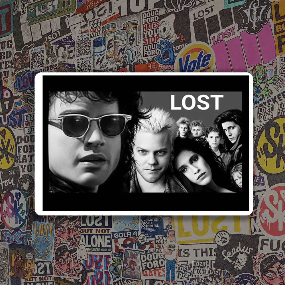 The Lost Boys sticker by LOST. Black and white design featuring an image from the movie- The Lost Boys. The good one. Not the remake. A wall of colorful graffiti stickers provides a unique background for the sticker.