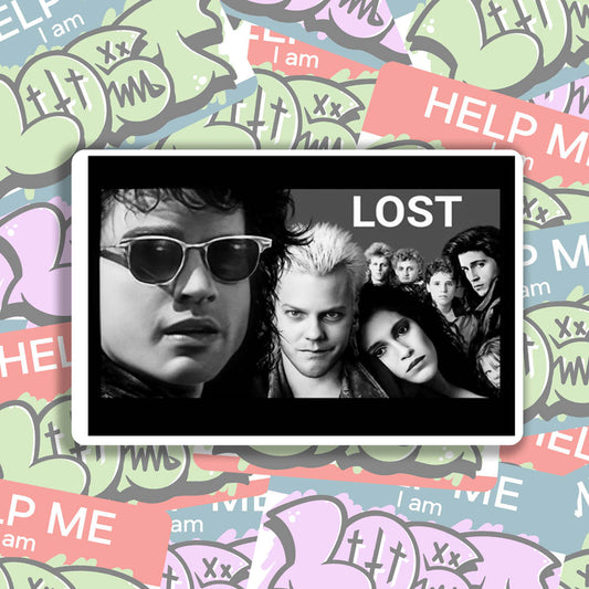 The Lost Boys sticker by LOST. Black and white design featuring an image from the movie- The Lost Boys. The good one. Not the remake. A wall of colorful graffiti stickers provides a unique background for the sticker.