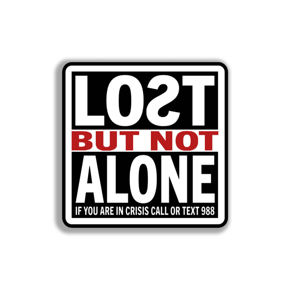 The Lost But Not Alone Sticker by artist and mental health advocate Christopher Reilly. This squared sticker features text stating Lost But Not Alone, if you are in crisis call or text 988. The black, white and red sticker design promotes mental health awareness and suicide prevention.