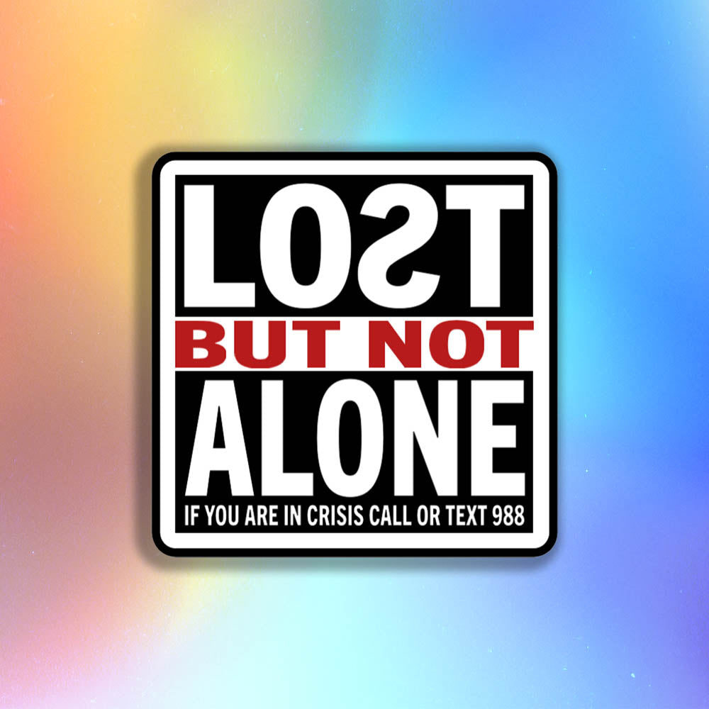 The Lost But Not Alone Sticker by artist and mental health advocate Christopher Reilly. This squared sticker features text stating Lost But Not Alone, if you are in crisis call or text 988. The black, white and red sticker design promotes mental health awareness and suicide prevention.