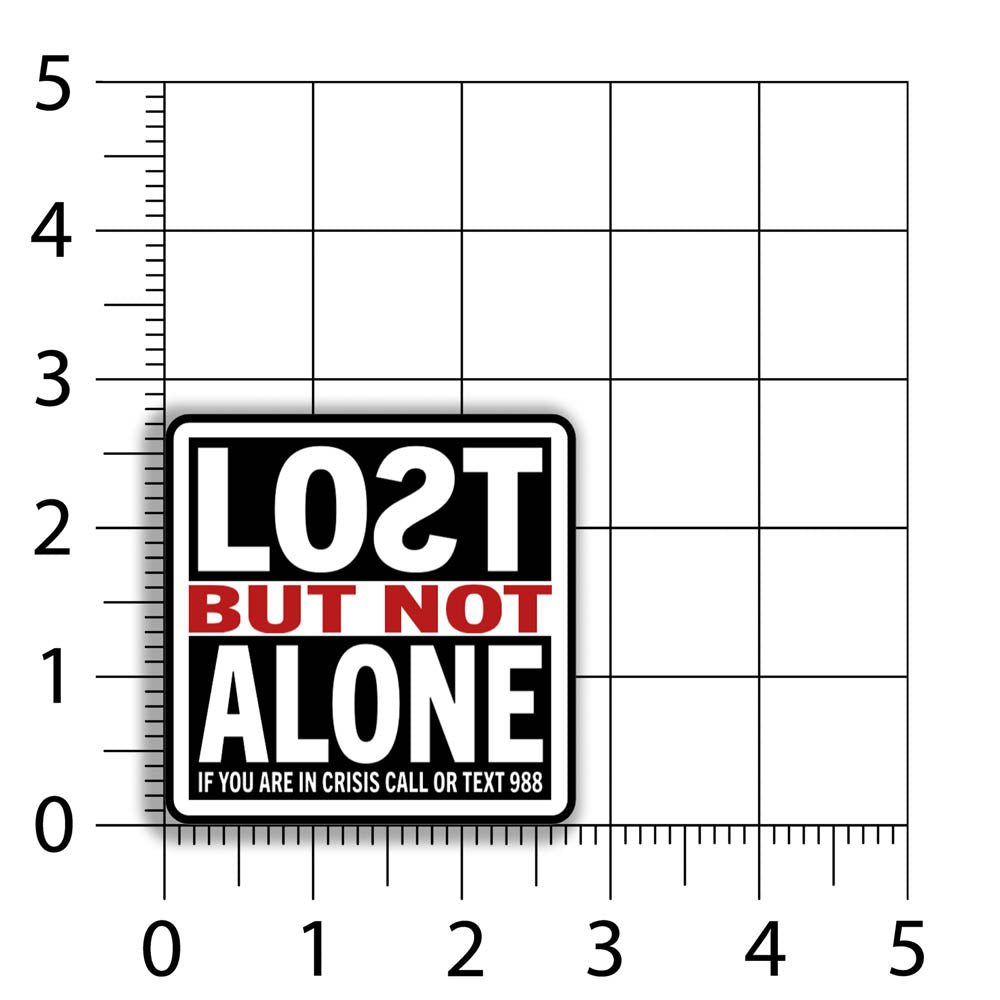 The Lost But Not Alone Sticker by artist and mental health advocate Christopher Reilly. This squared sticker features text stating Lost But Not Alone, if you are in crisis call or text 988. The black, white and red sticker design promotes mental health awareness and suicide prevention. A sizing grid indicates that this sticker is 2.75 by 2.75 inches big.