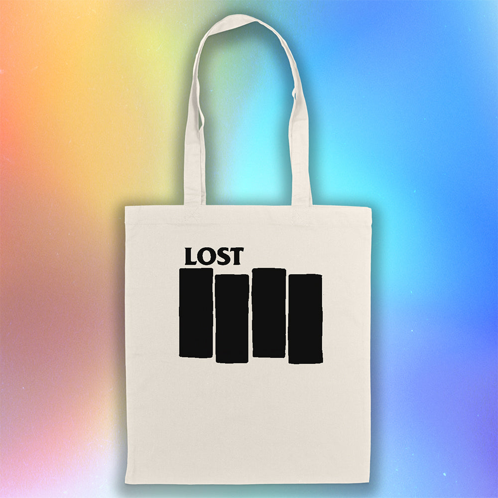 The Lost Flag tote bag. Four Solid black bars  and the word LOST printed across a large, natural canvas tote bag.
