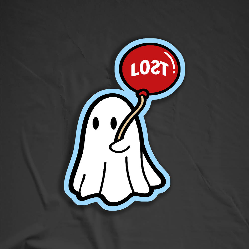 The Sad Ghost graffiti sticker by LOST. Full color die cut design of white ghost holding a red balloon. The sticker is outlined in a light shade of blue. The black photo backdrop provides dramatic contrast to the sticker.