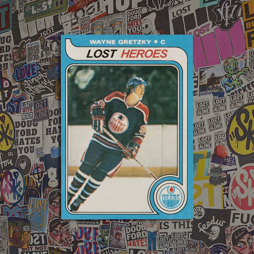 Lost Heroes graffiti sticker that features a replica Wayne Gretzky rookie card with the team name listed at Lost Heroes. The sticker is displayed against a background of graffiti stickers. 