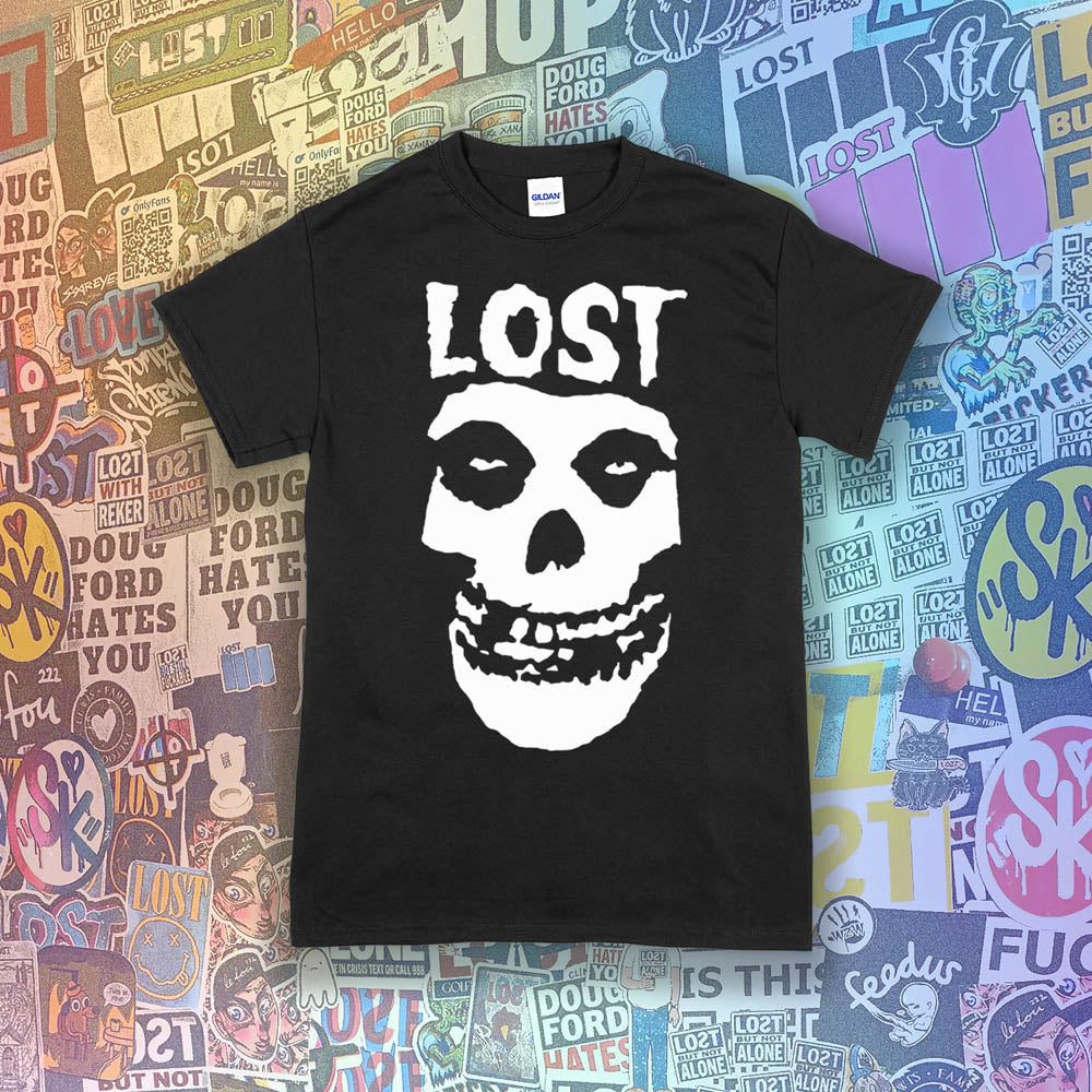 The Lost Crimson Ghost t-shirt. A Bold white skull screen printed and displayed on a black shirt. An assortment of graffiti stickers sets the background for this classic design upgraded by Lost Streetwear.