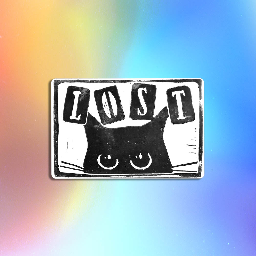 Peekers the cat graffiti sticker by LOST. A black and white image of a black cat peeking out at you with LOST written in above it. The sticker is set against a holographic background.