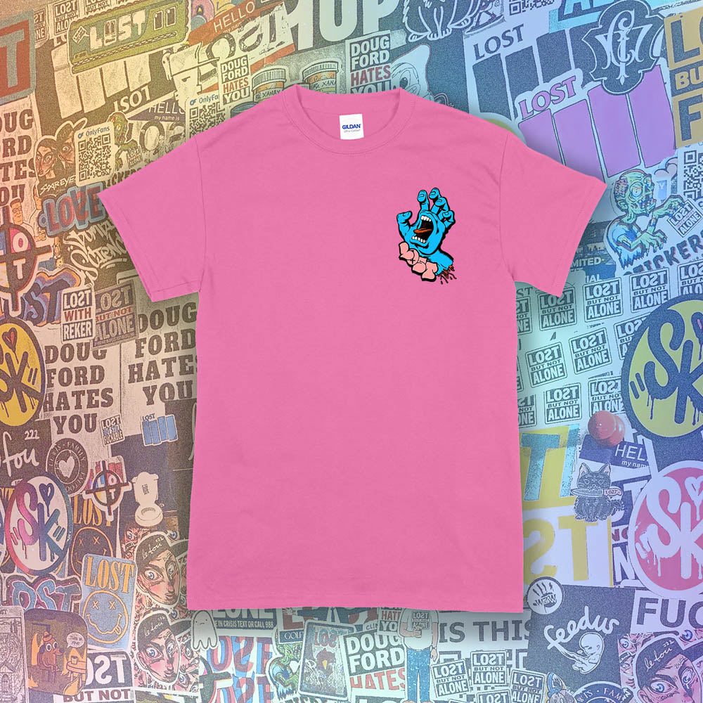 The screaming hand t-shirt re-design by Lost Streetwear. Full color severed hand graphic printed and displayed on a bright pink t-shirt. A wall of graffiti stickers by artists from around the world provides a colorful background for this re-imagined classic design.
