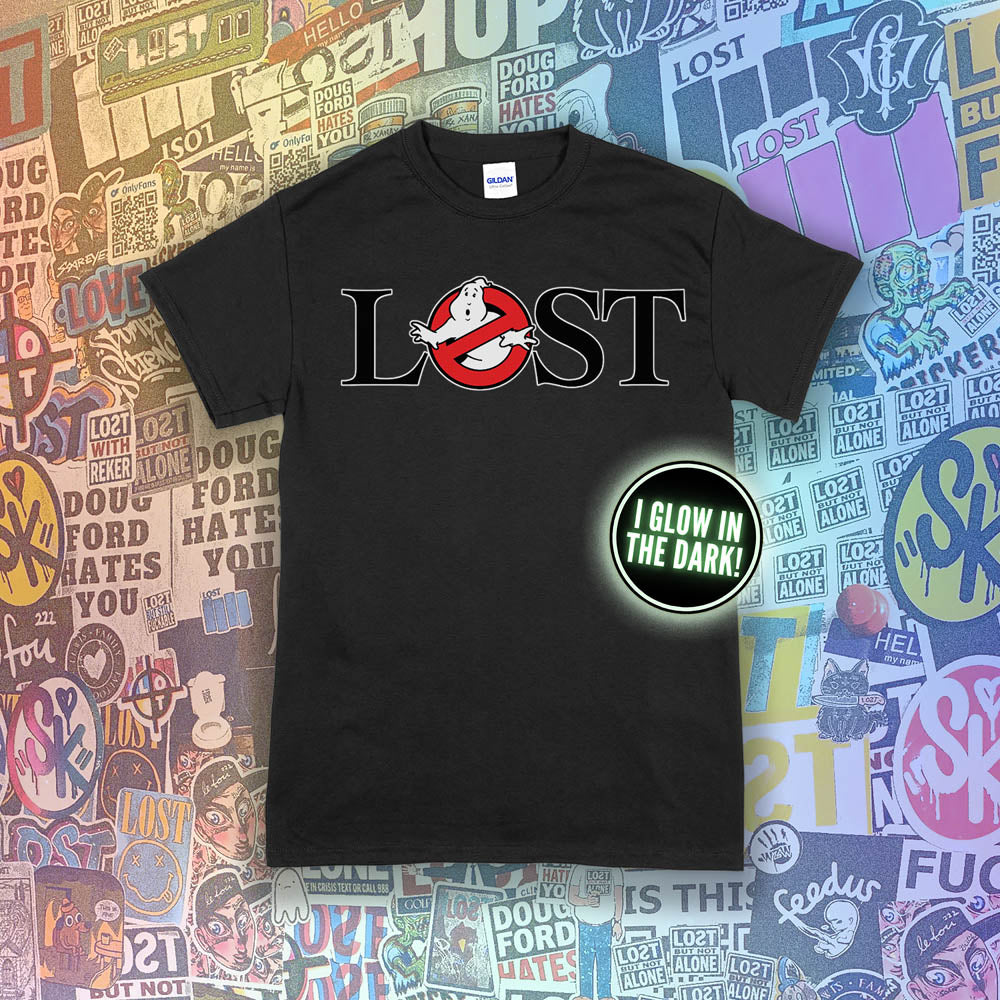 Who ya gonna call? Lostbusters! Screen printed logo with a glow in the dark ghost. Printed and displayed on a black t-shirt with a collection of graffiti stickers providing the background.