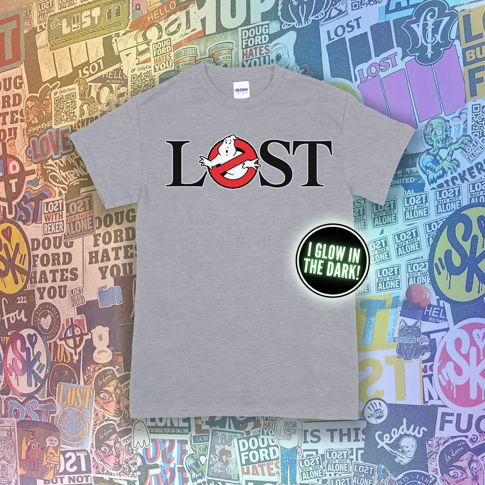 Who ya gonna call? Lostbusters! Screen printed logo with a glow in the dark ghost. Printed and displayed on a grey t-shirt with a collection of graffiti stickers providing the background.