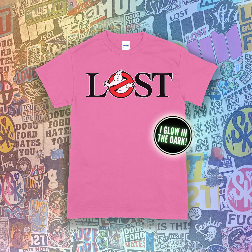 Who ya gonna call? Lostbusters! Screen printed logo with a glow in the dark ghost. Printed and displayed on a bright pink t-shirt with a collection of graffiti stickers providing the background.