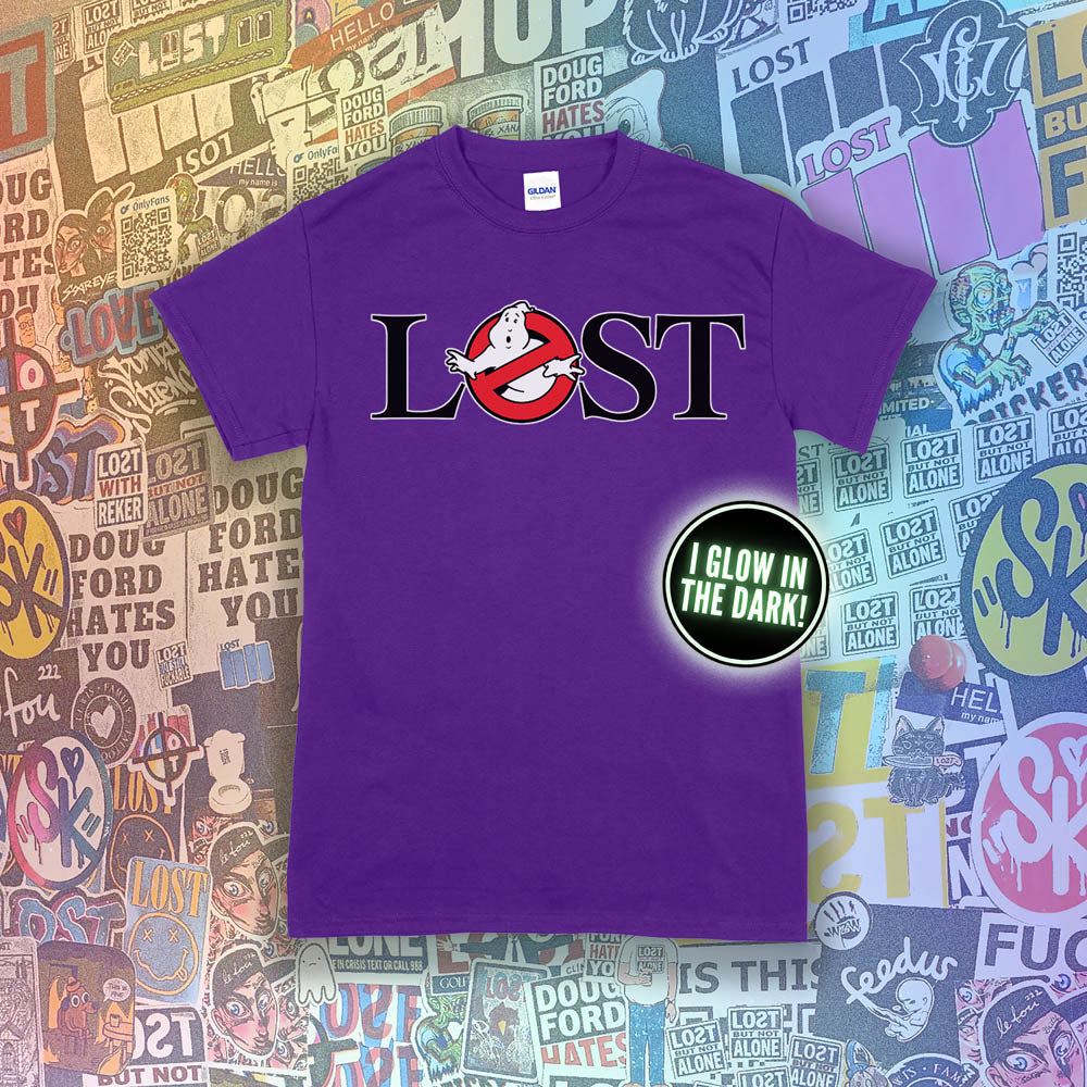 Who ya gonna call? Lostbusters! Screen printed logo with a glow in the dark ghost. Printed and displayed on a purple t-shirt with a collection of graffiti stickers providing the background.
