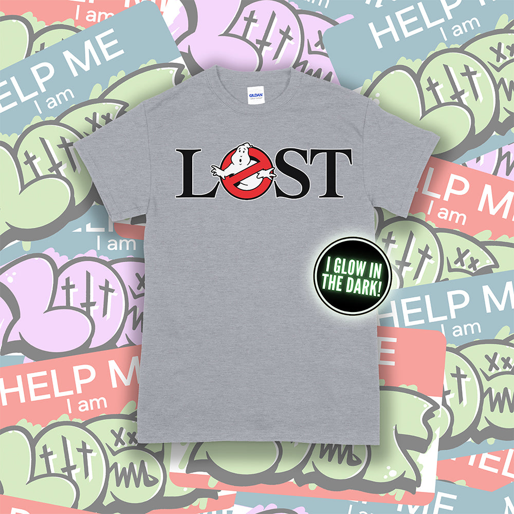 Who ya gonna call? Lostbusters! Screen printed design with a glow in the dark ghost. Light gray shirt with a colorful graffiti sticker background.