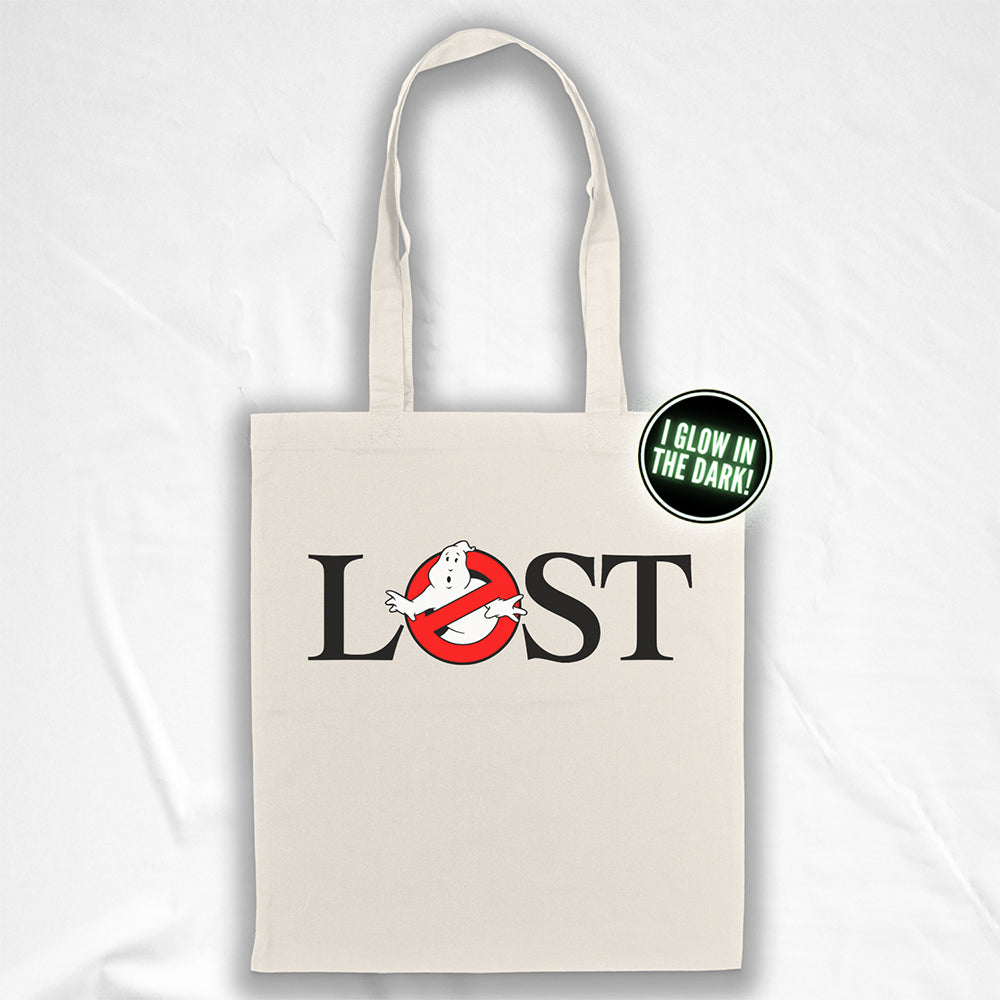 The LOSTBUSTERS tote bag features a surprised looking  ghost trapped in the O of the word LOST and vaguely resembling the original Ghostbusters logo. The crisp image is screen printed on a natural canvas tote bag.