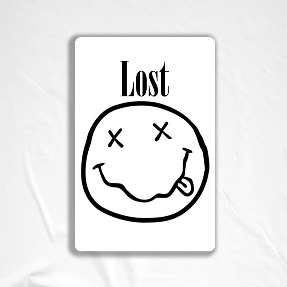 The In Bloom sticker by LOST. Black and white smiley face design with  LOST written above it.