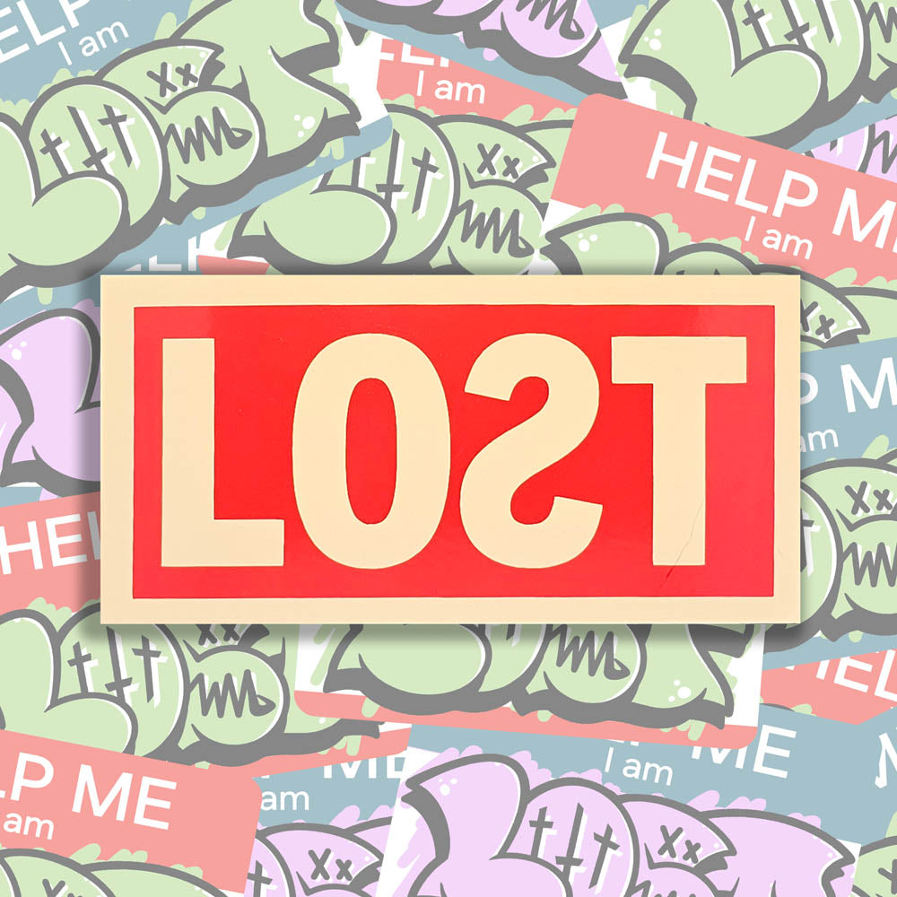 The original graffiti sticker by LOST. A simple two color cut design featuring the word LOST written with a backwards S in tan and contained within a red rectangle. The sticker is set against a collection of colorful graffiti stickers.