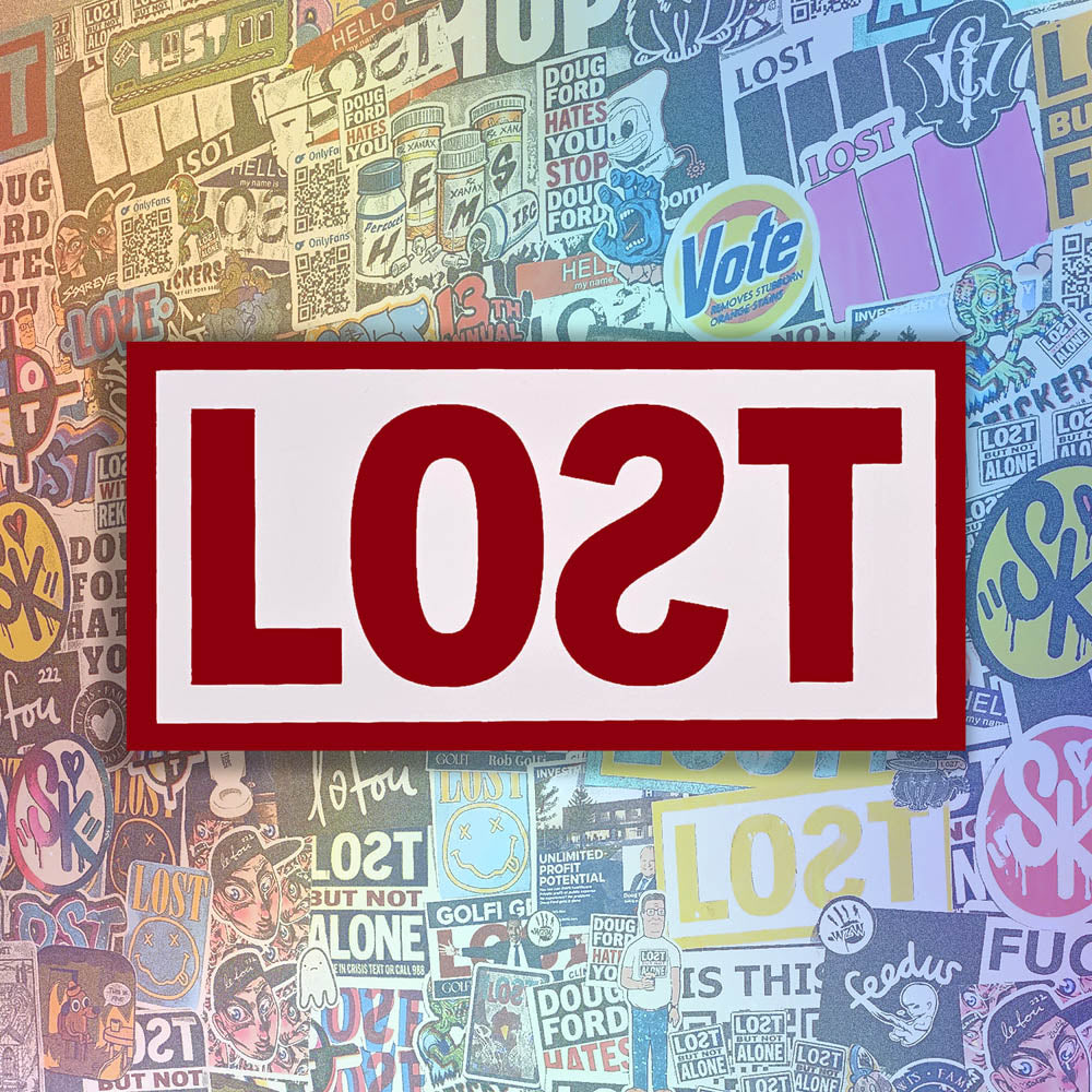 The original graffiti sticker by LOST. A simple two color cut design featuring the word LOST written with a backwards S in deep red and contained within a matte white rectangle. The sticker is set against a wall of colorful graffiti stickers by artists from around the world.