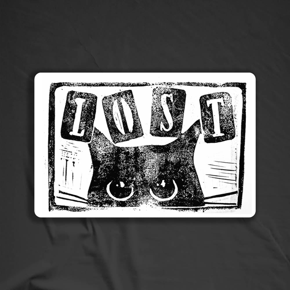 The Peekers Peeking thermal sticker by LOST. A drawing of a black cat peeking back at you with LOST written above it in block letters.