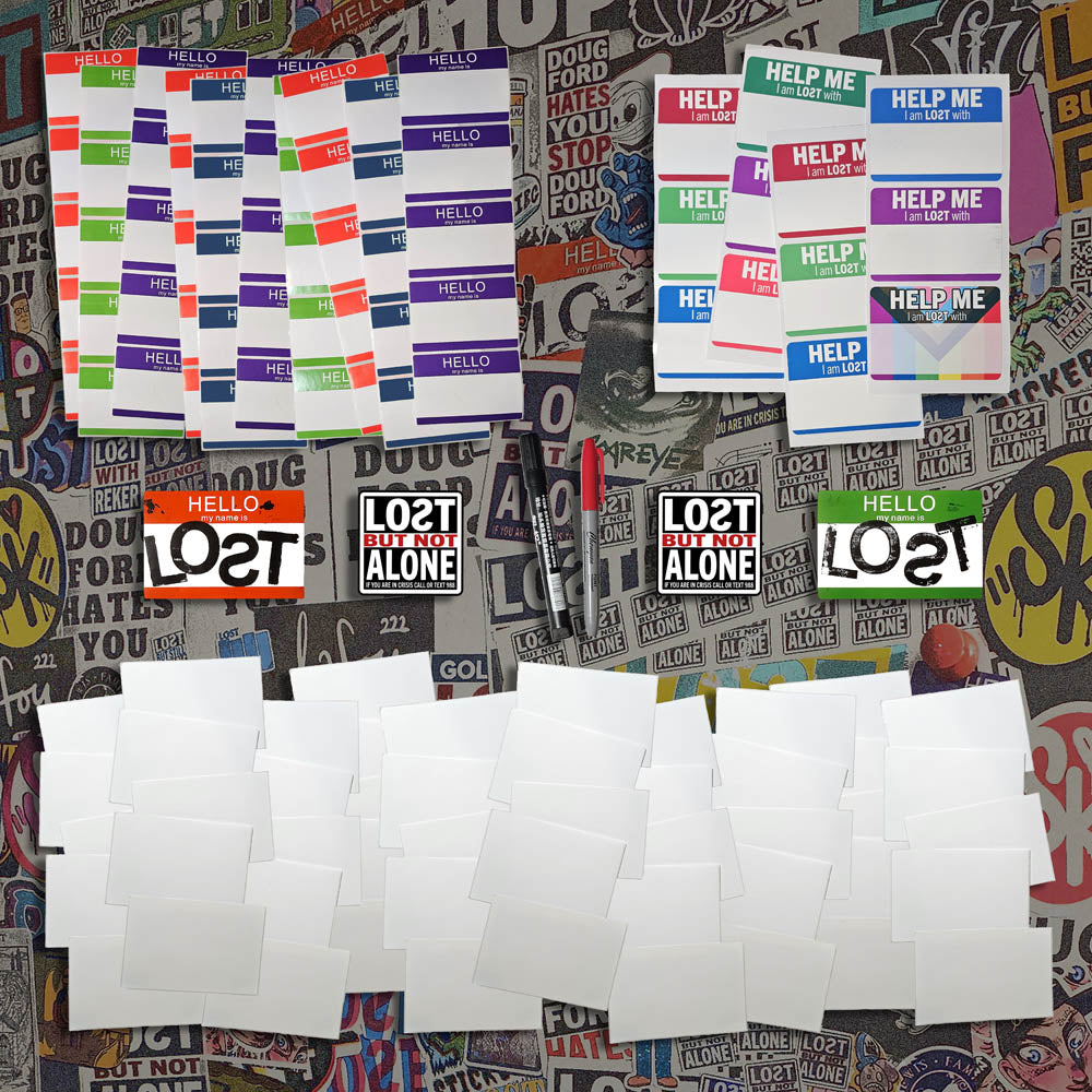 A selection of blank graffiti stickers and markers laid of for display.