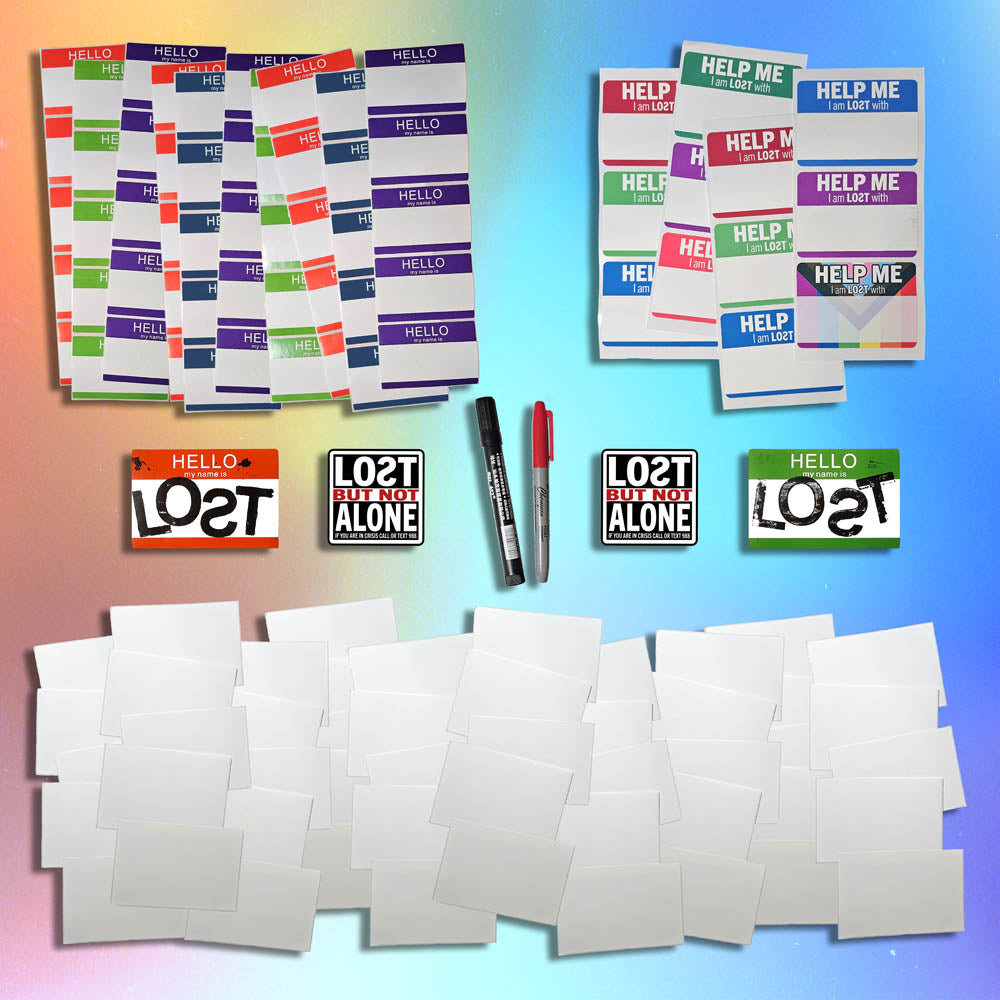 A selection of blank graffiti stickers and markers laid of for display.