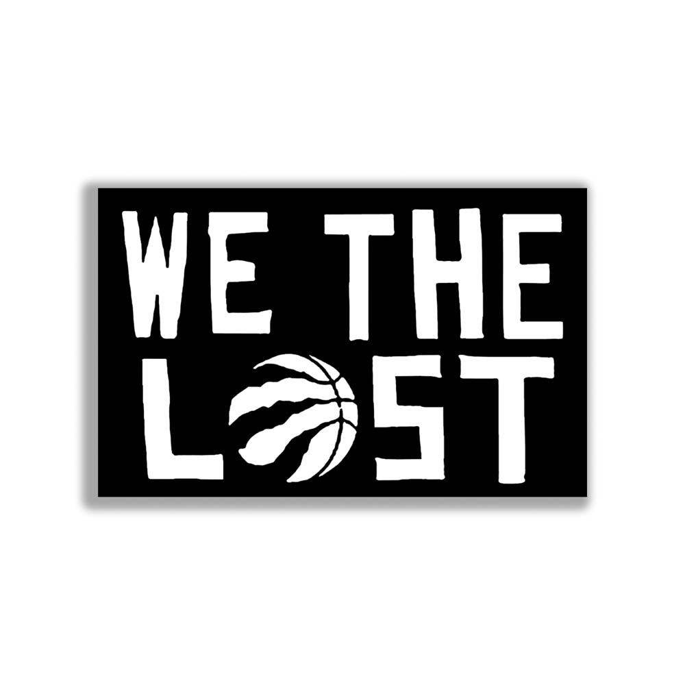 The We The Lost graffiti sticker. Bold white lettering and raptor claw design on a black sticker. The O in the word LOST is a basketball with claws. The sticker is set against a solid white background