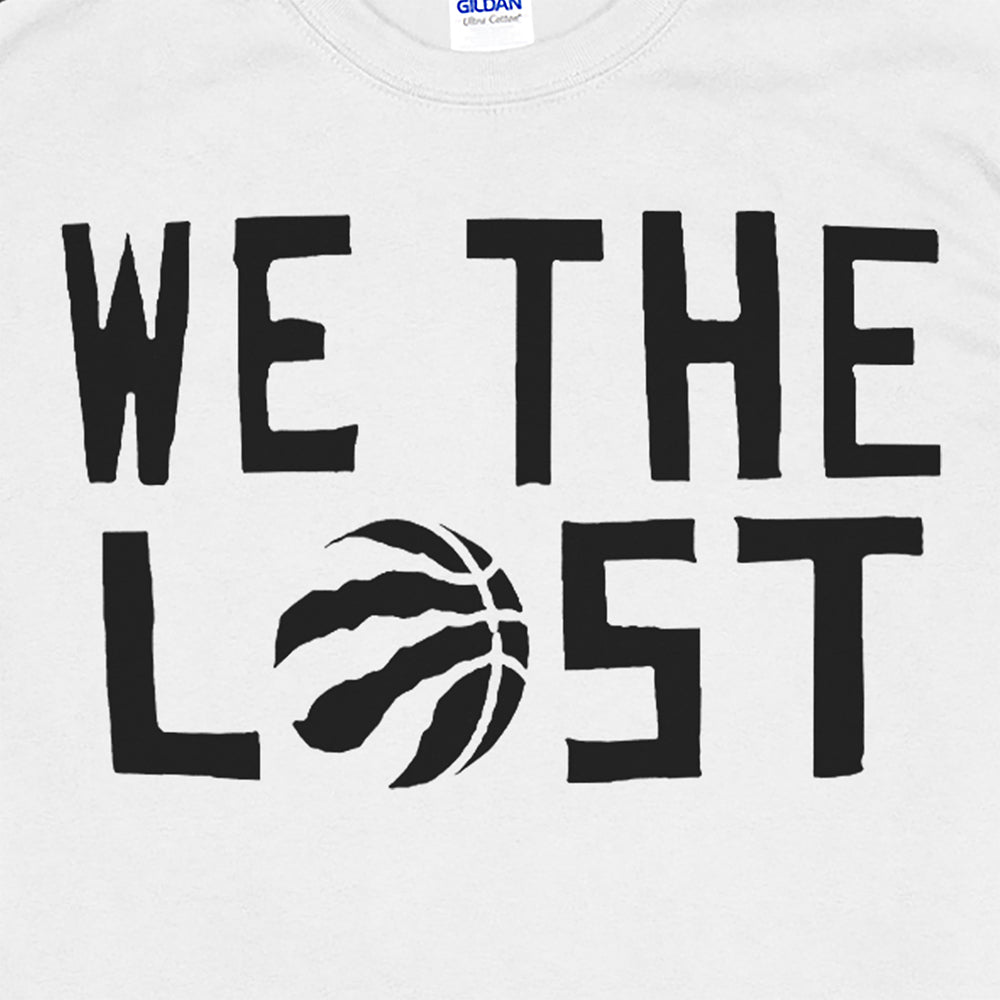 Close up of the We The Lost t-shirt. Bold black lettering and raptor claw screen printed on a bright white shirt.