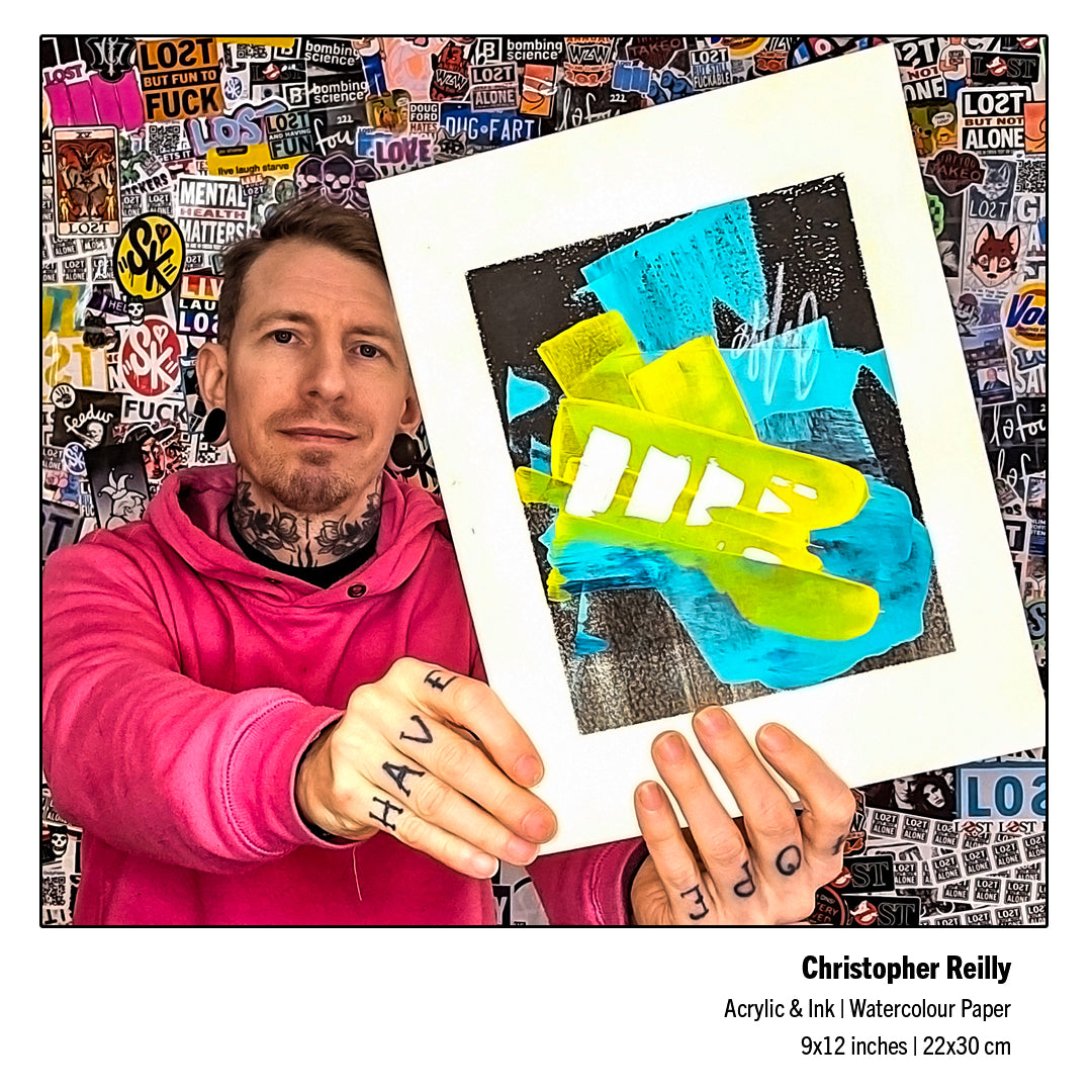 Canadian abstract fine artist Christopher Reilly holding up his completed original 9x12 mixed-media artwork, Painting 243, revealing the true visual scale, saturated yellow hues, and distinctive background ink textures.